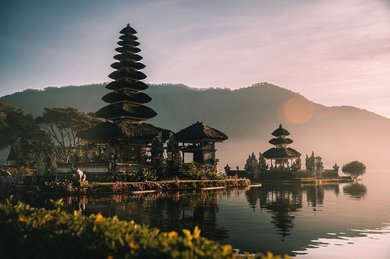 Ulun Danu Beratan temple reflected in lake at sunrise in Bali