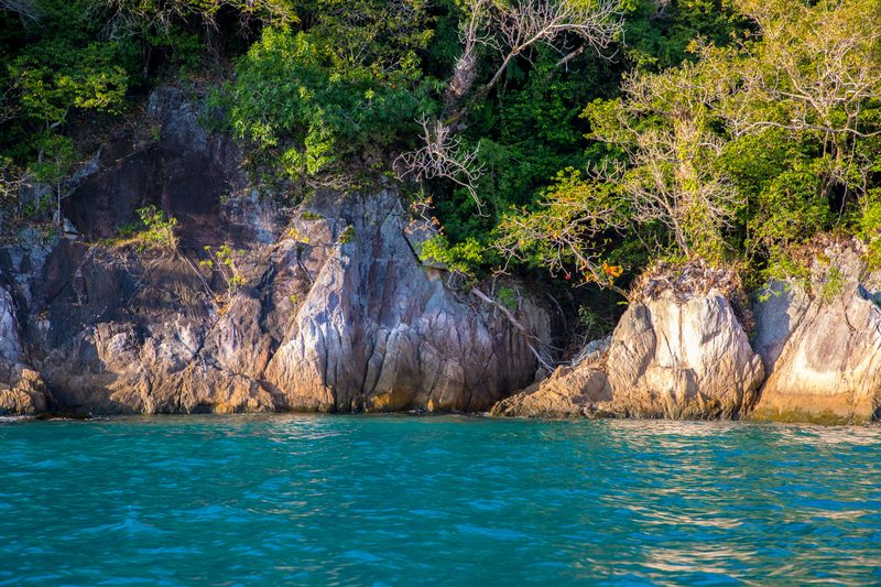 Rocky tropical coastline with turquoise water on Malaysia's east coast