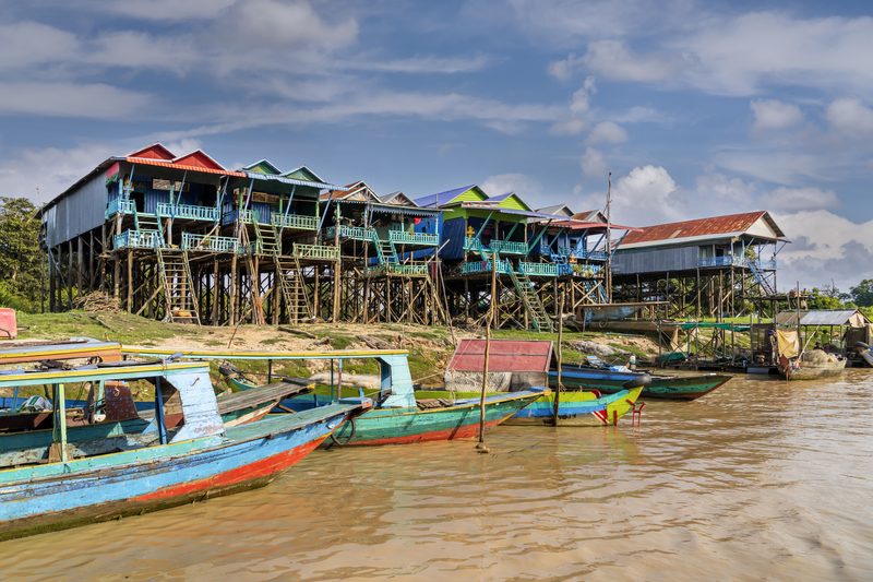 Colorful stilt houses and boats along Tonle Sap lake in Cambodia