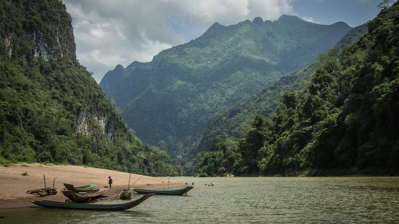 Longtail boats on the Nam Ou River beneath karst peaks, Laos
