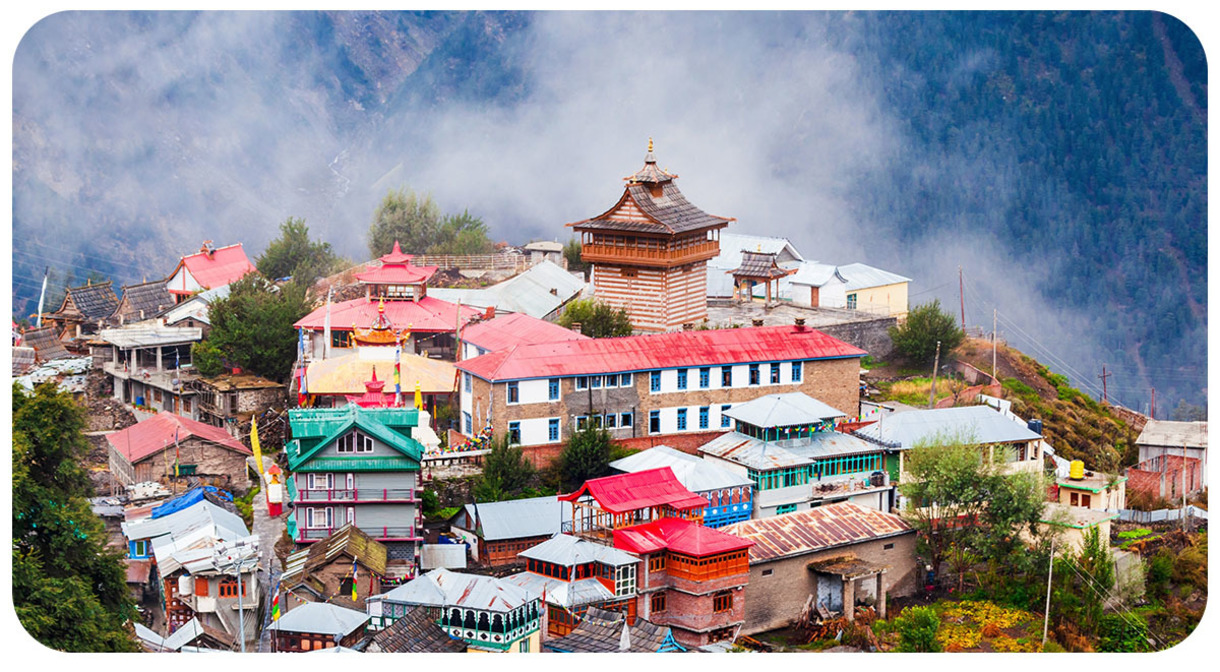 View of mountain town with colorful buildings.