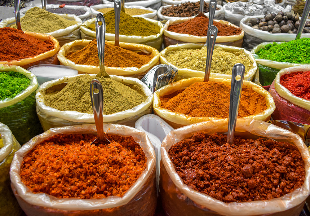 Colorful array of Indian spices at Kochi market in Kerala, India.