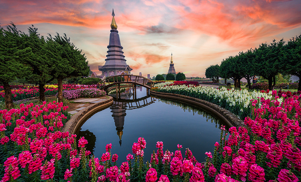Doi Inthanon national park of Thailand. View of man-made lake, bridge and colorful gardens.