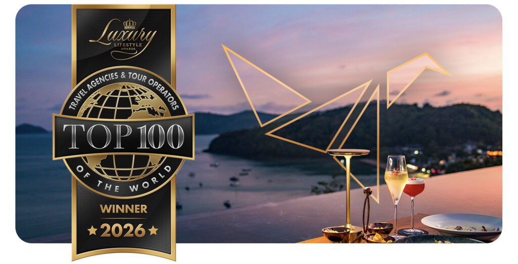 Sunset view over a bar with cocktails. Outline of ATJ logo image, next to Luxury Lifestyle Awards Top 100 logo