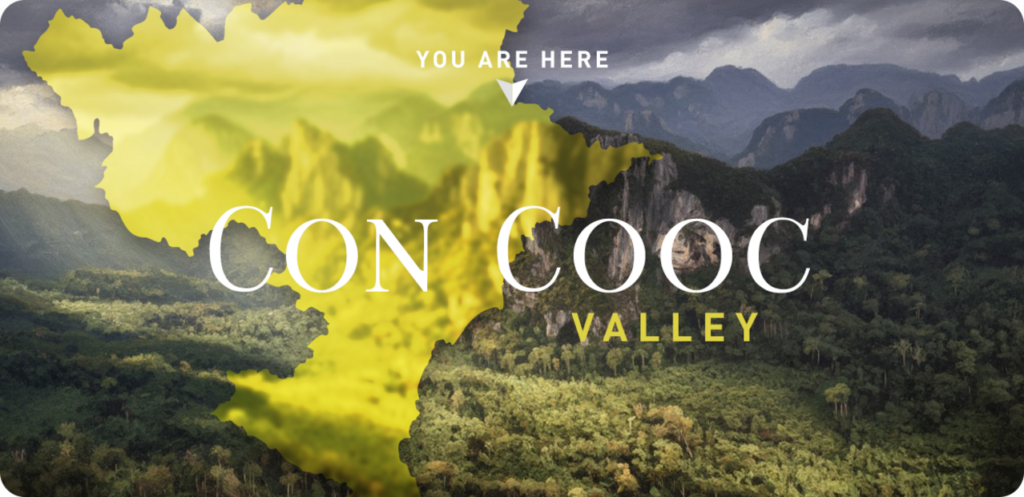 Landscape view of a large forest with rocky mountains in the background. In the foreground a map of Vietnam, and the title Con Cooc Hidden Valley Vietnam